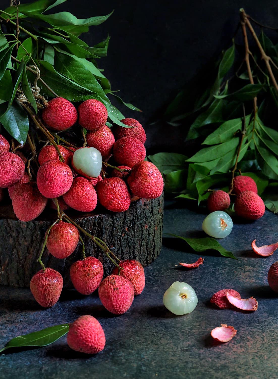 Lychee fruit on a tree log